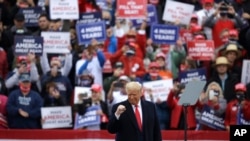 President Donald Trump gestures at the conclusion of a campaign rally at Lancaster Airport, in Lititz, Pennsylvania, Oct. 26, 2020. 