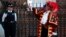 Tony Appleton, a town crier, rings his bell as he announces the birth of the royal baby, outside St. Mary's Hospital exclusive Lindo Wing in London, Monday, Jul. 22, 2013.