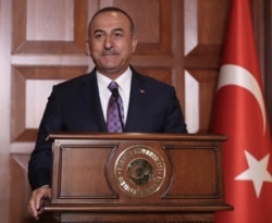Turkish Foreign Minister Mevlut Cavusoglu speaks to journalists, in Ankara, Turkey, Sept. 10, 2019.