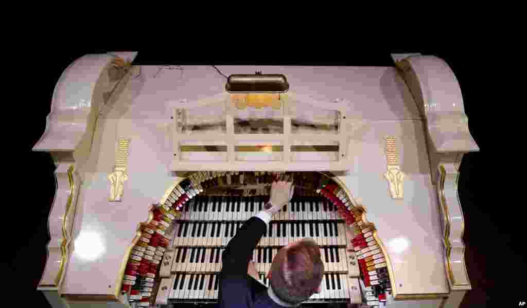 Organist Richard Hill plays a newly restored 1903&#39;s American Wurlitzer Theatre Pipe Organ, which is believed to be the largest in Europe, at the Troxy entertainment venue in London. The Wurlitzer holds over 1,728 pipes ranging from 16 ft (4.9 meters) to 1 inch (2.5 cm) housed in four separate rooms, four keyboards, one pedal board and 241 stop keys, and has taken six years to restore.