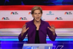 FILE - Democratic presidential hopeful Massachusetts Senator Elizabeth Warren participates in the first Democratic primary debate of the 2020 presidential campaign at the Adrienne Arsht Center for the Performing Arts in Miami, June 26, 2019.