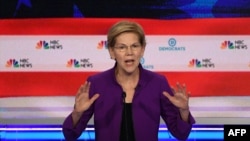 Democratic presidential hopeful US Senator from Massachusetts Elizabeth Warren participates in the first Democratic primary debate of the 2020 presidential campaign season hosted by NBC News at the Adrienne Arsht Center for the Performing Arts in Miami.