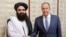 In this photo released by Russian Foreign Ministry Press Service on Oct. 4, 2024, Russian Foreign Minister Sergey Lavrov and Acting Foreign Minister of Afghanistan's Taliban movement Amir Khan Muttaqi pose for a photo before their talks in Moscow.