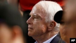 FILE - Sen. John McCain, R-Ariz., watches a baseball game between the Arizona Diamondbacks and the Los Angeles Dodgers in Phoenix, Aug. 10, 2017. 