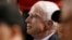 FILE - Sen. John McCain, R-Ariz., watches a baseball game between the Arizona Diamondbacks and the Los Angeles Dodgers in Phoenix, Aug. 10, 2017. 
