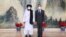 Người đồng sáng lập Taliban, Mullah Abdul Ghani Baradar - trong bức ảnh chụp cùng Bộ trưởng Ngoại giao Trung Quốc Vương Nghị ở Thiên Tân, sẽ lãnh đạo một chính phủ mới của Afghanistan.