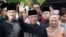 Malaysia's Prime Minister Designate and former interior minister Muhyiddin Yassin waves to reporters before his inauguration as the 8th prime minister, outside his residence in Kuala Lumpur, Malaysia, March 1, 2020. REUTERS/Lim Huey Teng TPX…
