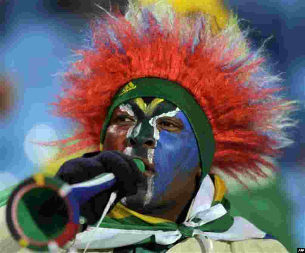 A South Africa soccer fan blows a vuvuzela prior to the World Cup group A soccer match between South Africa and Uruguay at the Loftus Versfeld Stadium in Pretoria, South Africa, Wednesday, June 16, 2010. (AP Photo/Marcio Jose Sanchez)