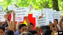 Vietnamese people hold a protest against China in front of the Chinese Embassy in Hanoi, Vietnam, June 5, 2011