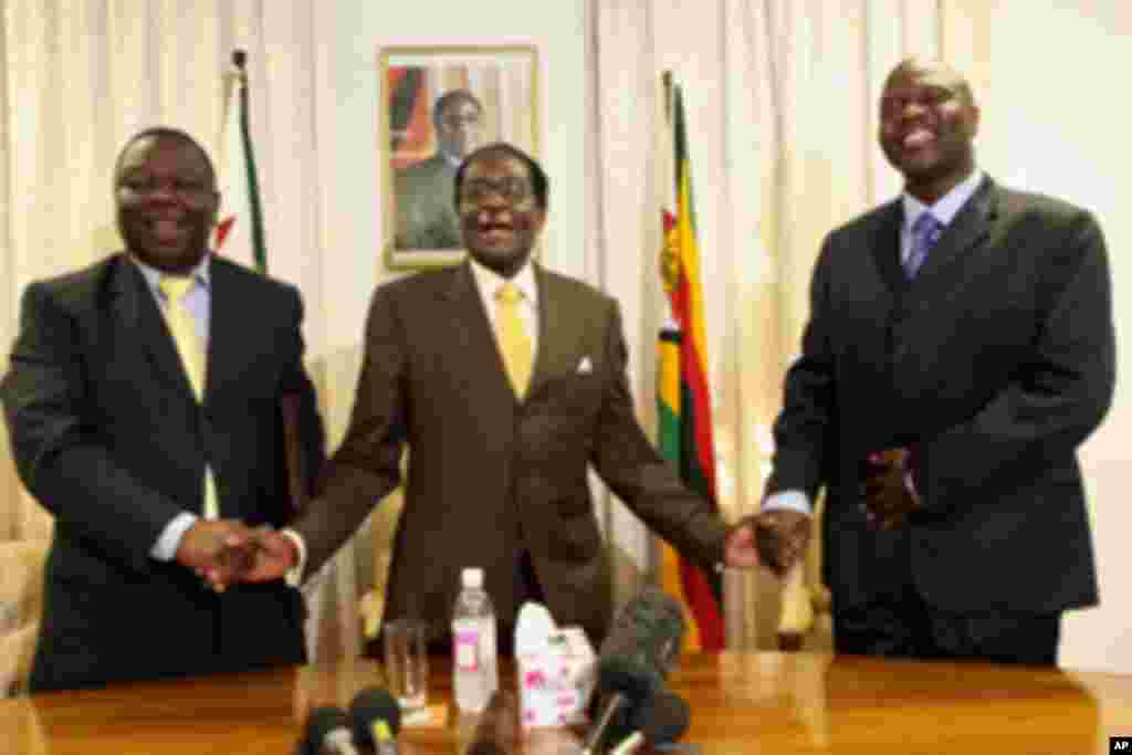 President Robert Mugabe with Morgan Tsvangirai, left, Zimbabwe's Prime Minister and his Deputy, Arthur Mutambara after giving their end of year message to the nation in 2009. The three leaders said they had made progress in clearing the outstanding issue