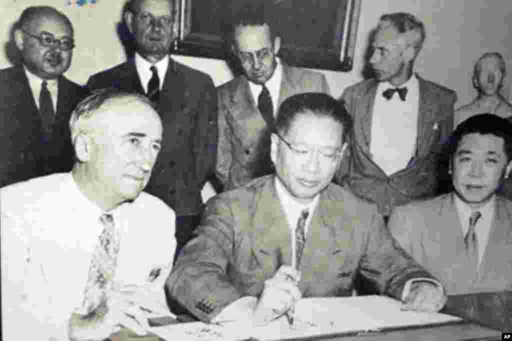 A policewoman searches a voter during the National assembly election at a polling station in Tripoli July 7, 2012. Libyans began voting in their first free national election in 60 years on Saturday, a poll designed to shake off the legacy of Muammar Gadda