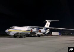 In this photo from the Ukrainian Presidential Press Office, the plane carrying Ukrainian experts prepares to depart for Tehran at Borispil international airport outside Kyiv, Ukraine, Jan. 8, 2020.