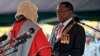Emmerson Mnangagwa, right, is sworn in as President at the presidential inauguration ceremony in the capital Harare, Zimbabwe Friday, Nov. 24, 2017. Mnangagwa is being sworn in as Zimbabwe's president after Robert Mugabe resigned on Tuesday, ending his 37-year rule. (AP Photo/Ben Curtis)