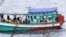 FILE - Fishing boat carrying Vietnamese asylum seekers nears shore of Australia's Christmas Island, April 14, 2013.