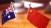 FILE - Chinese and Australian flags are displayed on a table at Parliament House in Canberra on March 20, 2024.