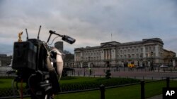 Media cameras outside Buckingham Palace, in London, Jan. 10, 2020.