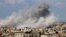 TOPSHOT - Smoke billows after an Israeli air strike in Rafah in the southern Gaza Strip on October 16, 2023.