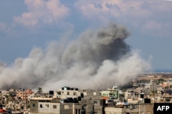 FILE- Smoke billows after an Israeli air strike in Rafah in the southern Gaza Strip on October 16, 2023.