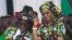 Zimbabwean first lady Grace Mugabe, right, is seen with her husband, President Robert Mugabe at a rally in Gweru, Zimbabwe, Sept, 1, 2017. 