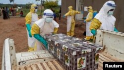 FILE - Healthcare workers carry the coffin of a baby believed to have died of Ebola, in Beni, North Kivu Province of Democratic Republic of Congo, Dec. 15, 2018. 