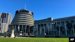 FILE - People arrive at Parliament in Wellington, New Zealand, on July 24, 2024.