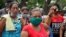 Relatives of inmates protest outside Los Llanos penitentiary in Venezuela on May 2, 2020, after a riot erupted inside the prison, killing dozens.
