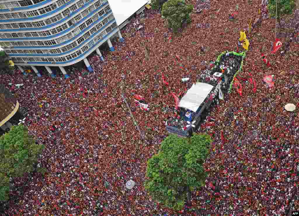 Aerial view of fans surrounding a bus carrying the Flamengo football team during a celebration parade in Rio de Janeiro, Brazil, after their Libertadores Final football match victory against Argentina&#39;s River Plate in Lima, Peru, Nov. 14, 2019.