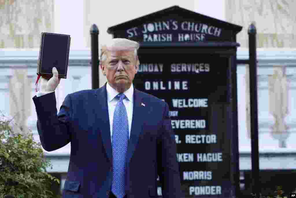 President Donald Trump holds a Bible as he visits outside St. John&#39;s Church across Lafayette Park from the White House, June 1, 2020, in Washington. Park of the church was set on fire during protests on Sunday night.