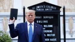 President Donald Trump holds a Bible as he visits outside St. John's Church across Lafayette Park from the White House Monday, June 1, 2020, in Washington. Park of the church was set on fire during protests on Sunday night. (AP Photo/Patrick…