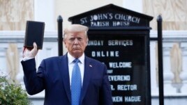FILE - President Donald Trump holds a Bible as he visits outside St. John's Church across Lafayette Park from the White House Monday, June 1, 2020, in Washington. (AP Photo/Patrick Semansky)
