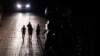 Joggers exercise on a dark street in San Juan, Puerto Rico after a major power outage hit the island, Dec. 31, 2024.