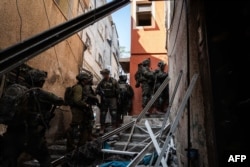 This handout picture released by the Israeli army on Feb. 20, 2024 shows Israeli army soldiers operating on the ground at an unspecified location in the Gaza Strip amid ongoing battles between Israel and the Palestinian militant group Hamas.