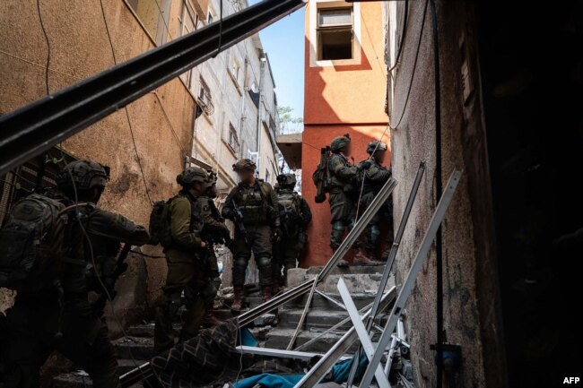 This handout picture released by the Israeli army on Feb. 20, 2024 shows Israeli army soldiers operating on the ground at an unspecified location in the Gaza Strip amid ongoing battles between Israel and the Palestinian militant group Hamas.