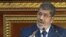 Image from Egyptian State Television shows Egyptian President Mohammed Morsi speaking at the Shura Council, the country's upper house of parliament, Cairo, December 29, 2012.
