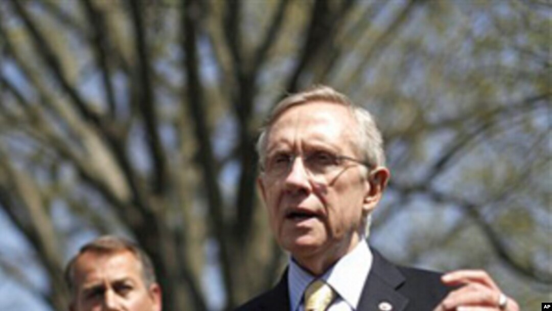 Senate Majority Leader Harry Reid (r) accompanied by House Speaker John Boehner of Ohio, talks to reporters outside the White House, April 7, 2011