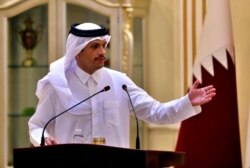 FILE - Qatar's foreign minister, Sheikh Mohammed bin Abdulrahman al-Thani, speaks during a press conference in Baghdad, Iraq, March. 24, 2021.