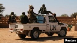 FILE - Chadian U.N. peacekeepers patrol in Aguelhok, Mali, Jan. 24, 2014.