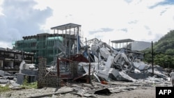 Damaged infrastructure is seen following an explosion at the Providence industrial area in Mahe on December 7, 2023.