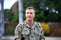 U.S. Navy Rear Adm. Robb Chadwick speaks to the media at the main gate at Joint Base Pearl Harbor-Hickam, Dec. 4, 2019, in Hawaii, following a shooting.