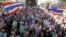 Anti-government protesters march in a rally in central Bangkok, Jan. 15, 2014. 