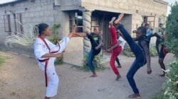 Seventeen-year-old Natsiraishe Maritsa, founder of the Vulnerable Underaged People's Auditorium Initiative, teaches her peers about the dangers of early pregnancy and early marriage and keeps them busy with martial arts. (Columbus Mavhunga/VOA)