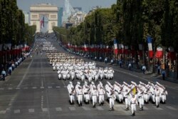FILE - French troops march down the Champs Elysee avenue during the Bastille Day parade in Paris, France, July 14, 2018.