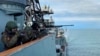 FILE - In this photo taken from video released by Russian Defense press service on Sept. 12, 2024, Russian service members stand on a deck of the Russian destroyer Vice Admiral Kulakov during exercises in the Arctic Ocean. 