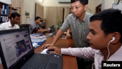 FILE - Voice of Democracy's news website is seen on a computer screen in an office in Phnom Penh, Cambodia, Aug. 31, 2017.