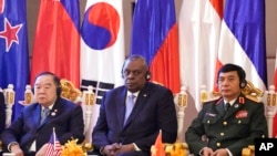 FILE - Prawit Wongsuwon, left, is shown with U.S. Secretary of Defense Lloyd Austin, center, and Vietnam Minister of Defense Phan Van Giang, right, during the 9th ASEAN Defense Ministers' Meeting Plus in Siem Reap, Cambodia, Nov. 23, 2022. 