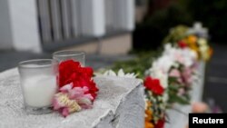 Flowers are placed in front of Gold Spa following the deadly shootings in Atlanta, Georgia, March 17, 2021. 