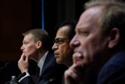 From left, FireEye CEO Kevin Mandia, SolarWinds CEO Sudhakar Ramakrishna and Microsoft President Brad Smith testify during the Senate Intelligence Committee hearing on Capitol Hill, Feb. 23, 2021.