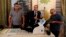 Employees of the Independent High Electoral Commission explain the election process, during a press conference in Baghdad, Iraq, April 30, 2018. 