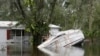 A boat is submerged outside a flooded home caused by Hurricane Milton near the Alafia River in Lithia, Florida, on Oct. 11, 2024.