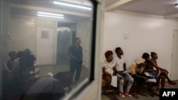 FILE - People wait to donate blood at a hospital in the Cite Soleil district of Port-au-Prince on Dec. 12, 2024. 